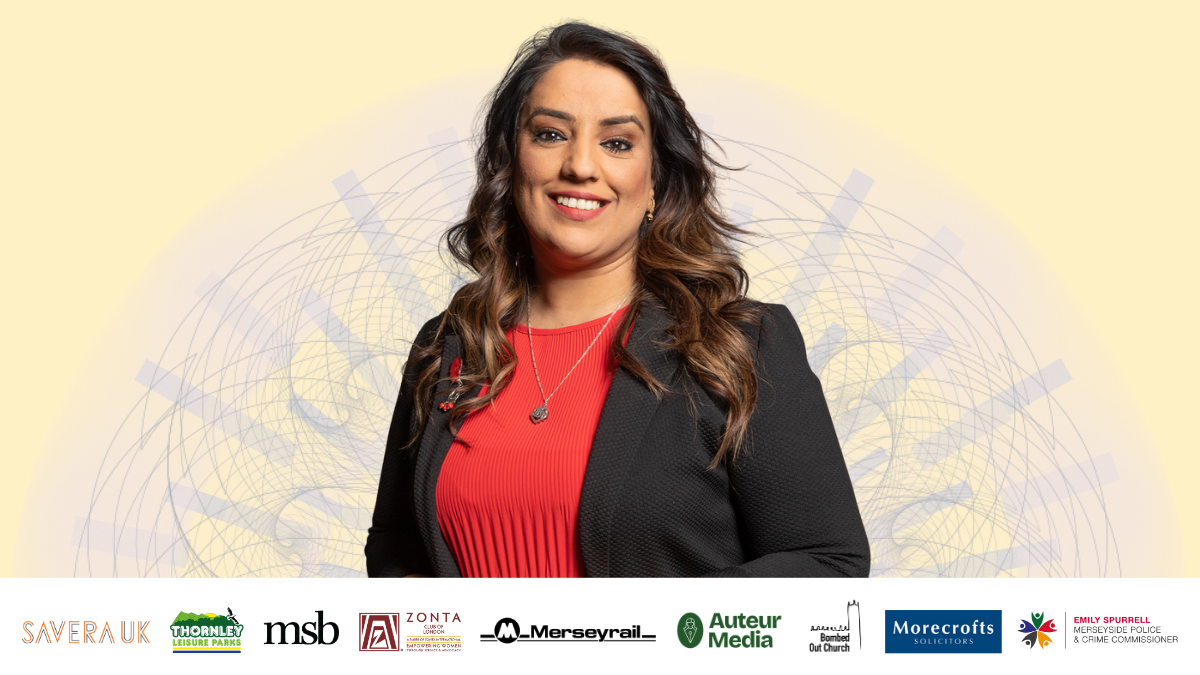 A woman with long dark hair, wearing a red pleated top and black blazer, smiling at the camera against a pale yellow background with faint abstract line artwork. Below her is a row of sponsor logos: Savera UK, Thornley Leisure Parks, msb, Zonta Club of London, Merseyrail, Auteur Media, Bombed Out Church, Morecrofts Solicitors, and Emily Spurrell Merseyside Police & Crime Commissioner.